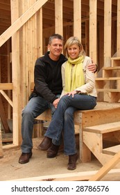 Happy Couple Inside Their New Home Still Under Construction.