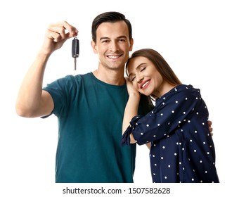 Happy Couple With Key From Their New Car On White Background