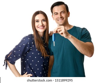 Happy Couple With Key From Their New Car On White Background