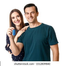 Happy Couple With Key From Their New Car On White Background