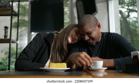 Happy Couple Kissing Dating At Coffee Shop. Diversity Concept Of Two People Kiss. Woman Leaning Head On Boyfriend Shoulder Showing Love And Affection