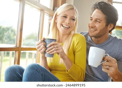 Happy couple, laughing and window with coffee for funny morning, holiday or weekend together at home. Young man and woman with smile, laughter or drink in friendly discussion or conversation at house - Powered by Shutterstock