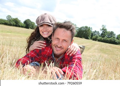 Happy Couple Laying Down Meadow