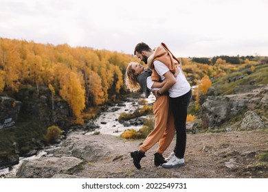 A Happy Couple In Love In Casual Clothes Travel Together, Hike And Have Fun In The Fall Forest On A Weekend In Nature In Autumn Outdoors, Selective Focus