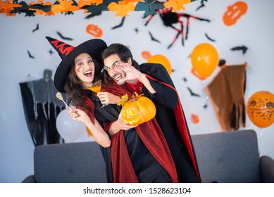 Happy Couple Of Love  In Costumes And Makeup On A Celebration Of Halloween