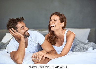 Happy couple, love and laughing in bedroom, morning or support for marriage commitment at house. Wake up, bonding or funny people with smile for romantic relationship, loyalty or anniversary together - Powered by Shutterstock