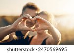 Happy couple, love and nature with heart hands for care, embrace or romance in nature. Closeup of man and woman with like emoji, shape or gesture in outdoor forest for workout, exercise or fitness