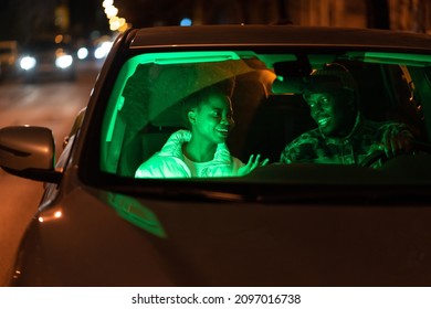 Happy Couple In Love Talk Inside Car. Man And Woman Lovers Communicate In Vehicle After Date, Enjoy Spending Time Together, Couldn't Stop Speaking At Night. Romantic Relationship And Romance Concept