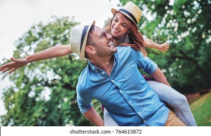 Happy couple. Loving couple enjoying in moments of happiness in the park. Love and tenderness, dating, romance. Lifestyle concept - Powered by Shutterstock