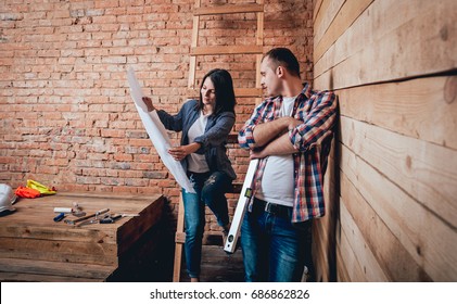 Happy couple making repairs to their home. Home Renovation - Shutterstock ID 686862826