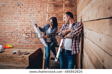 Happy couple making repairs to their home. Home Renovation 商業照片 © 