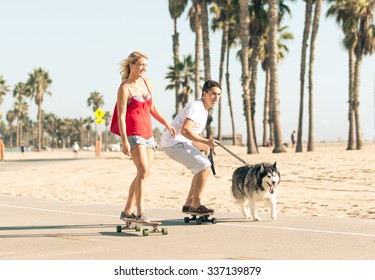 Happy couple making sport together with their husky dog