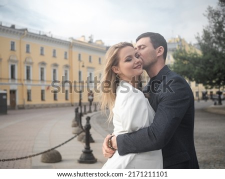 happy couple, a man and a woman on a city walk. A cheerful young couple walks in the city and has a good time together, a walk in St. Petersburg