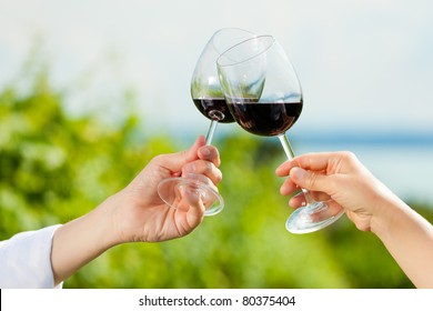 Happy Couple - Man And Woman, Only Hands To Be Seen - Drinking Wine At Lake In Summer