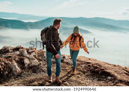 Similar – Image, Stock Photo Two people on hill Man