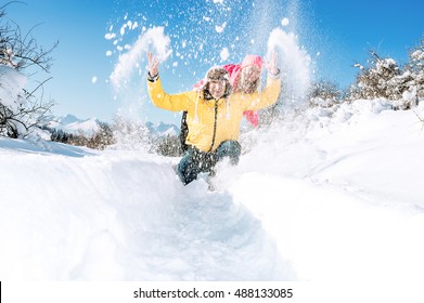 Happy Couple In Nature Enjoying In The Snow