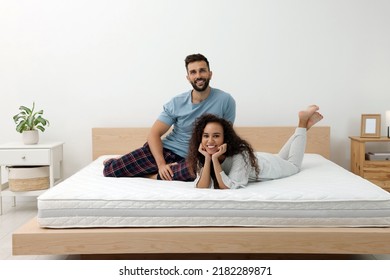 Happy couple on bed with comfortable mattress at home - Shutterstock ID 2182289871