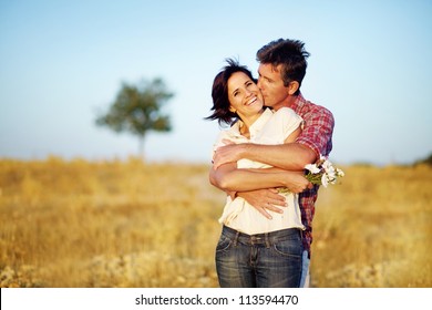 Happy Couple On The Field