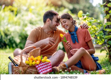 Happy couple on picnic in nature. Love,dating, people and nature concept. - Powered by Shutterstock