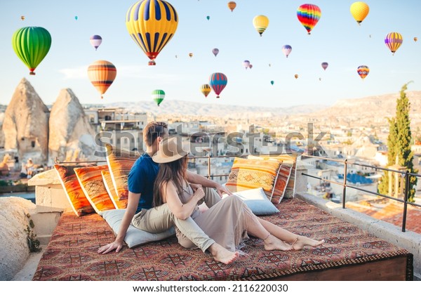 happy-couple-on-rooftop-cappadocia-hot-2116220030-shutterstock