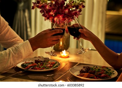 Happy couple on summer evening having romantic dinner.