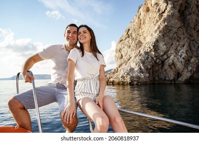 Happy Couple On A Yacht In Summer On Romantic Vacation