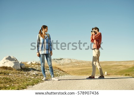 Similar – Image, Stock Photo Young couple taking a walk near the coast