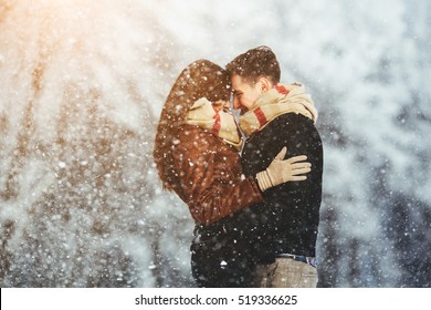 Happy Couple Playful Together During Winter Holidays Vacation Outside In Snow Park