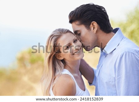 Happy couple, portrait and kiss in nature for romance, support or affection in outdoor bonding or date. Man and woman with smile on cheek for embrace, comfort or love in forest or woods together