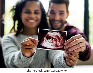 Happy couple with pregnancy news