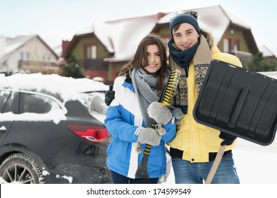 Happy Couple Are Ready To Cleaning Car From Snow