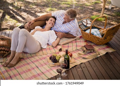 Happy couple relaxing in cottage during safari vacation - Powered by Shutterstock