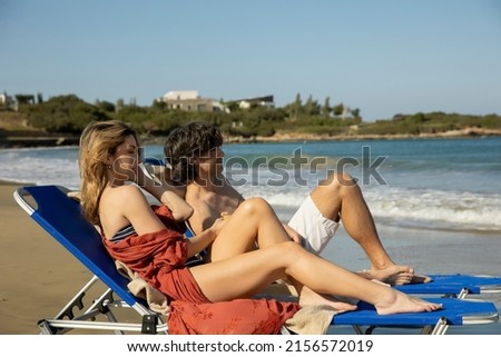 Happy couple relaxing on the beach