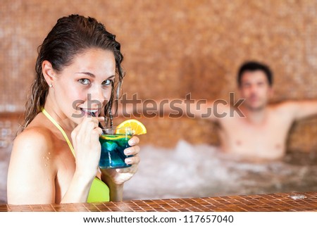 Happy couple relaxing in a spa