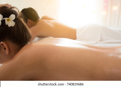 Happy Couple In Relaxing Spa Massage.