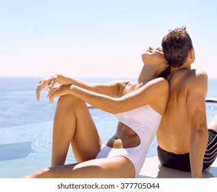 Happy couple relaxing in swimming-pool
