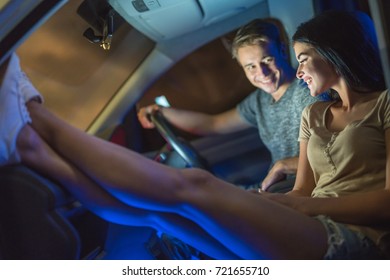 The Happy Couple Rest Inside The Car. Evening Night Time