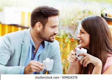 Happy couple in a restaurant having coffee. - Shutterstock ID 509824378