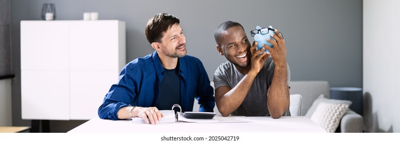 Happy Couple Saving Money In Piggy Bank