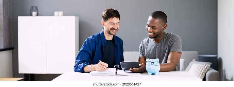 Happy Couple Saving Money In Piggy Bank