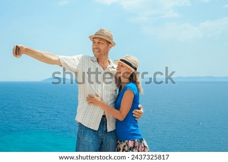 happy couple selfie at sea on travel