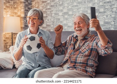 Happy Couple Of Seniors Or Football Fans Watching Soccer On Tv And Celebrating Victory At Home. Family, Sports And Entertainment Concept.