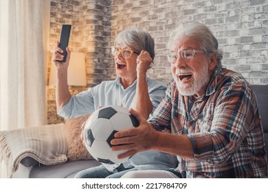 Happy Couple Of Seniors Or Football Fans Watching Soccer On Tv And Celebrating Victory At Home. Family, Sports And Entertainment Concept.