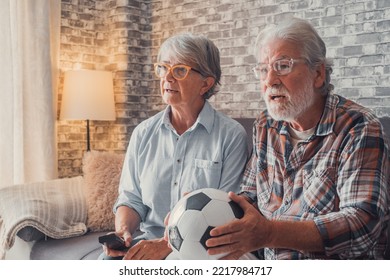 Happy Couple Of Seniors Or Football Fans Watching Soccer On Tv And Celebrating Victory At Home. Family, Sports And Entertainment Concept.