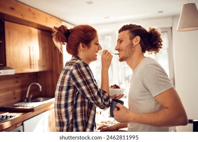 Happy Couple Sharing Breakfast in a Cozy Kitchen - Powered by Shutterstock