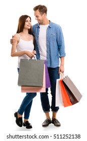 Happy Couple With Shopping Bags, Standing Close And Looking To Each Other With Smile. Caucasian Models In Love, Holiday Sales, Shop, Retail, Consumer Concept, Isolated On White Background.