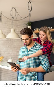 Happy couple shopping online on the internet. - Shutterstock ID 429960628