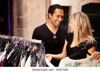 A Happy Couple Shopping At A Small Street Store In Europe