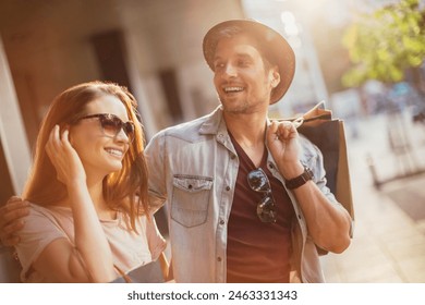 Happy couple shopping together in the city - Powered by Shutterstock