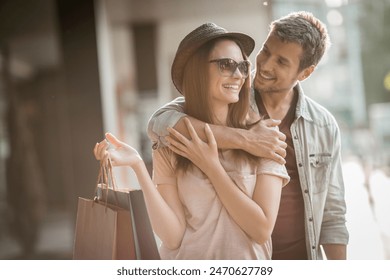 Happy couple shopping together in the city - Powered by Shutterstock